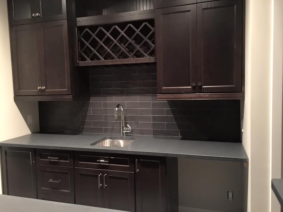 the basement bar backsplash tile is in a 4x16 subway tile