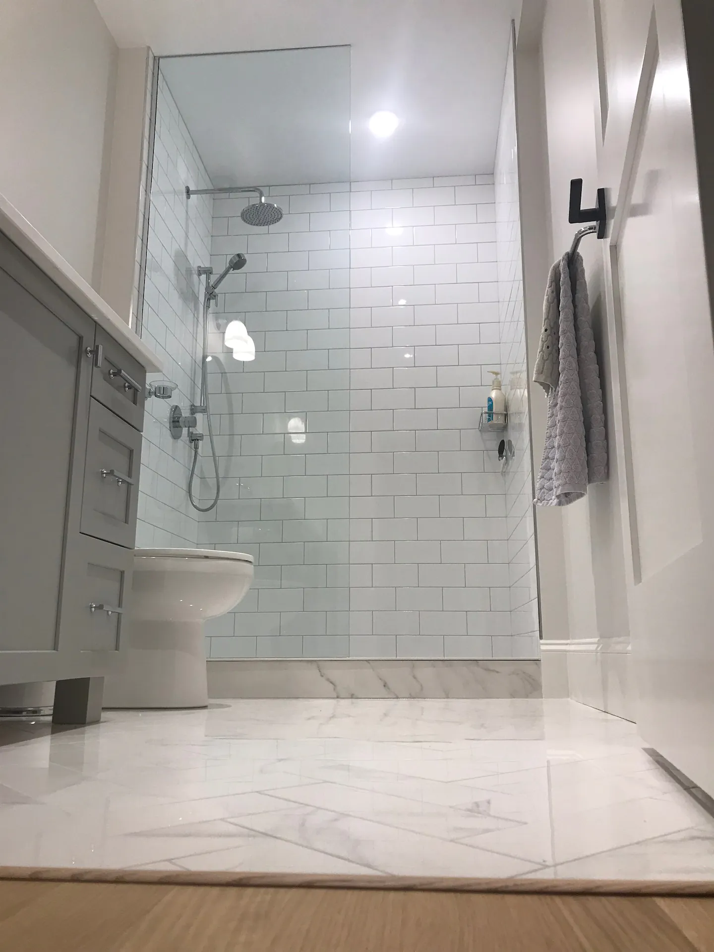 alcove stand shower subway tile with Schluter system and glass enclosure