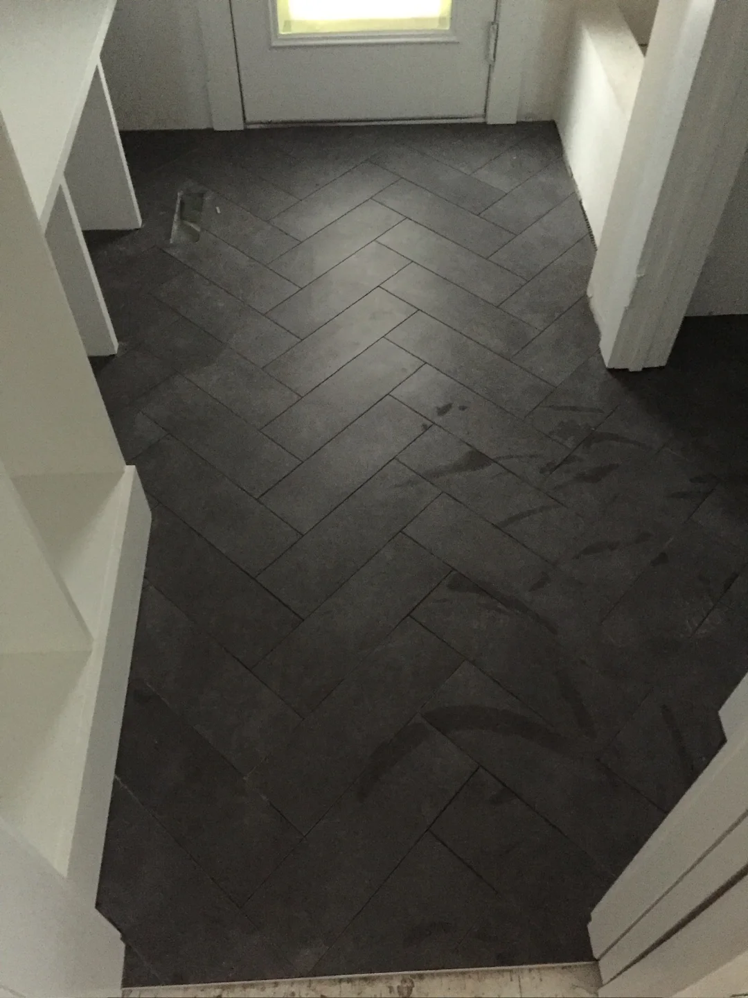edmonton herringbone mudroom tile installation in glenora custom build